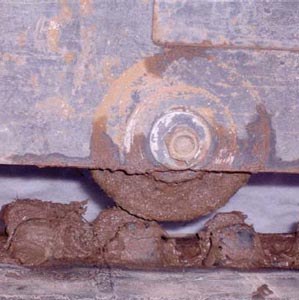 Excavator with plastic bushings